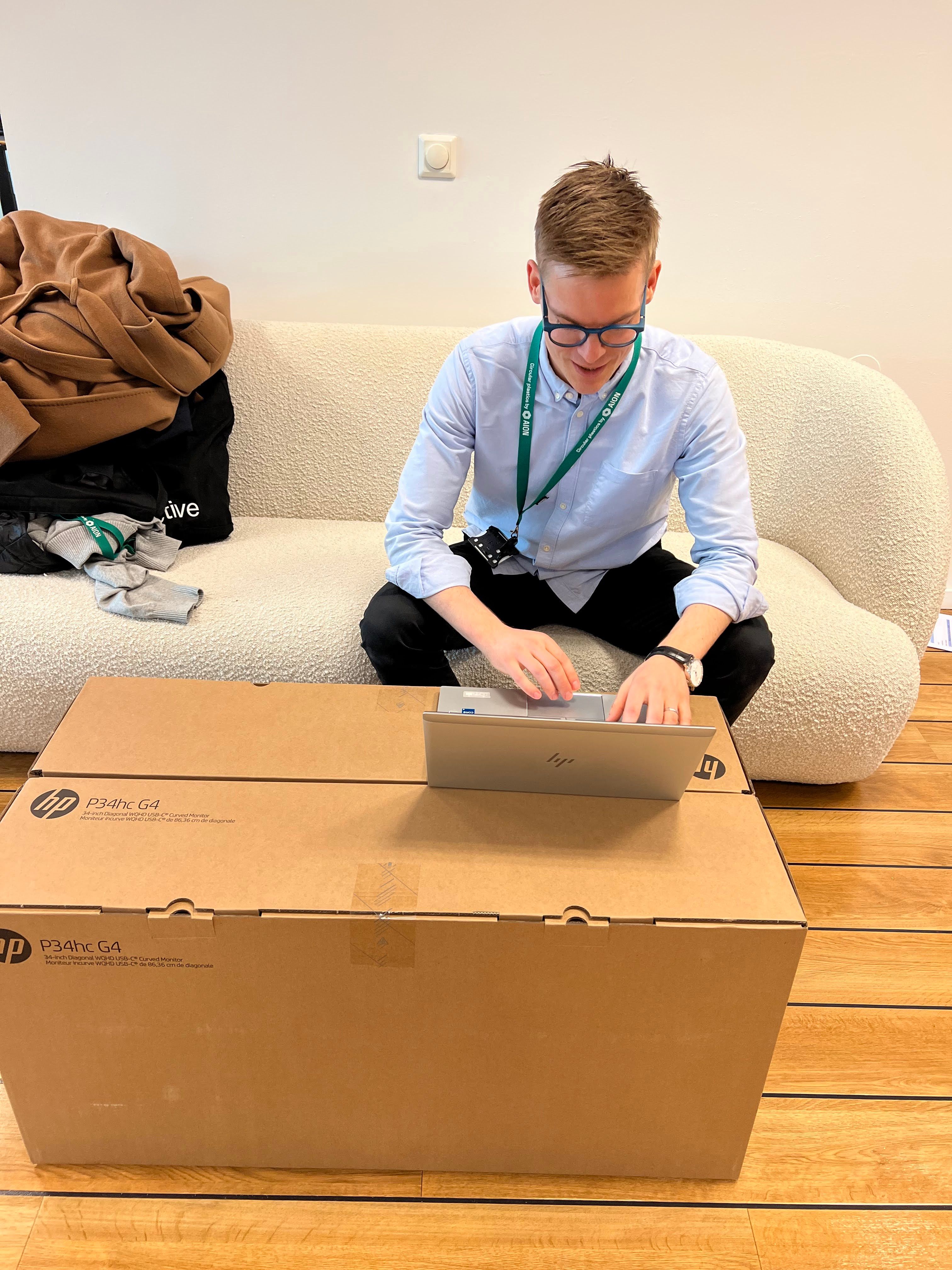 Senior Manager Circular Solutions, Søren Holm Grundt, working from a cardboard box